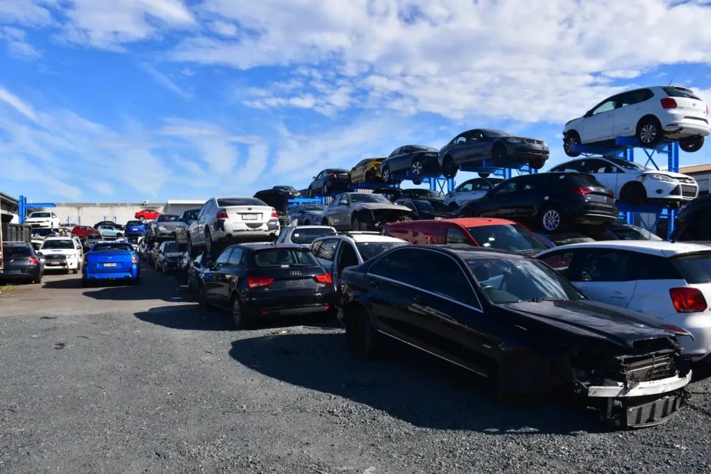 Car wreckers yard showing used engines and parts