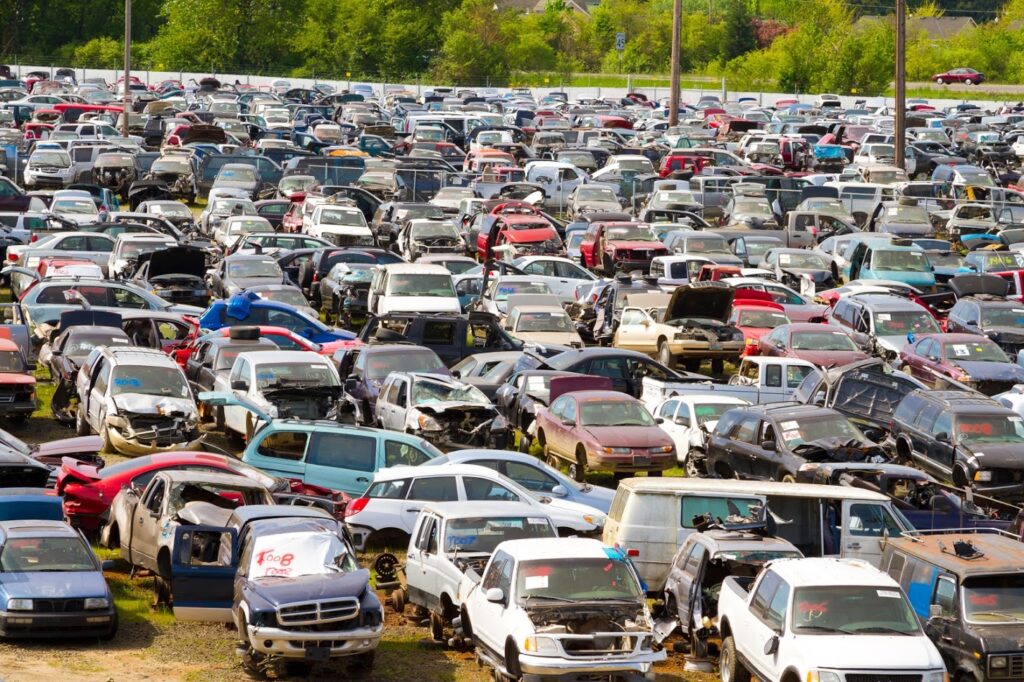 Car wreckers yard with salvaged auto parts